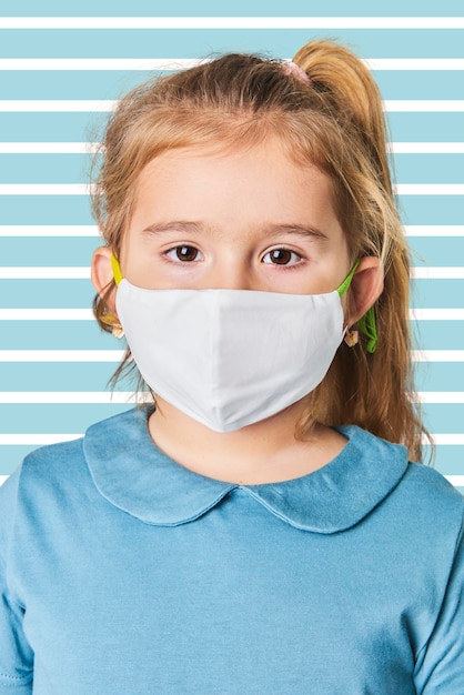 Psd little girl wearing white face mask mockup