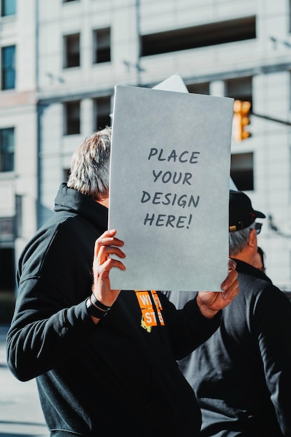 PSD psd mockup - a person holding a sign, a banner