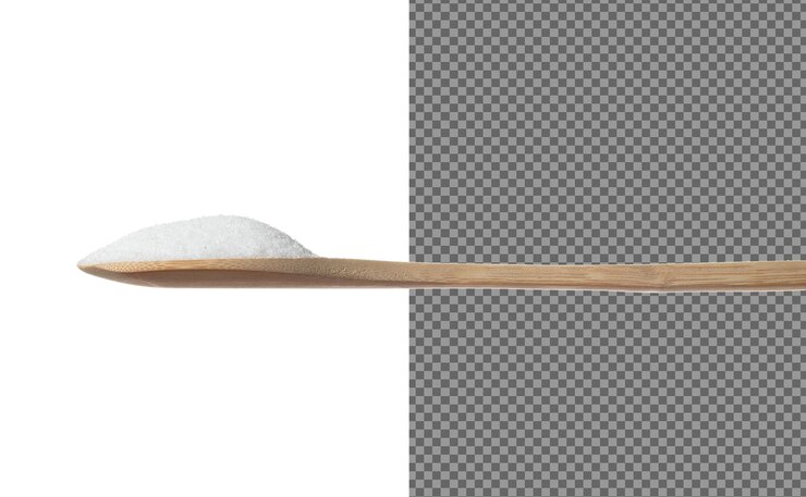 PSD pure refined sugar in table spoon white crystal sugar fall line down pure refined sugar stop in air food object design white background isolated high speed freeze motion