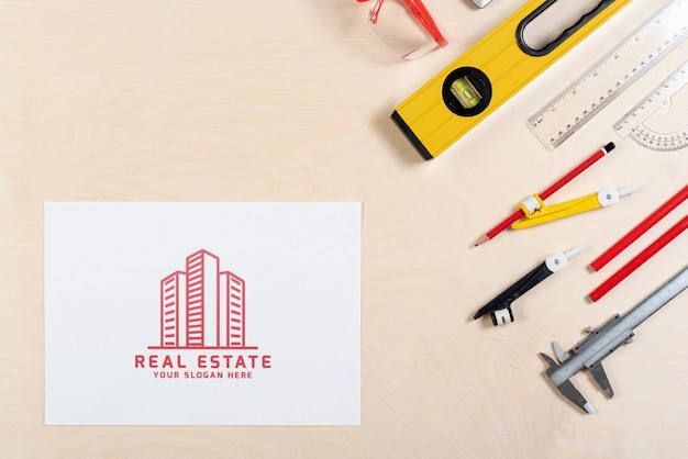 Real estate logo with buildings and stationery items