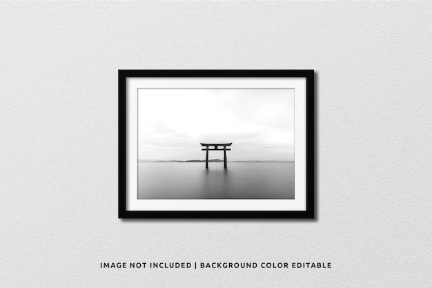 PSD realistic black landscape photo frame mockup on wall