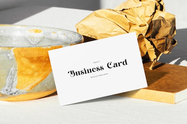 Realistic business card mockup on surface