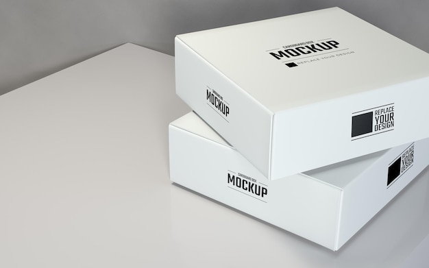 Primo piano realistico quadrato bianco scatole di cartone mockup design con sfondo grigio