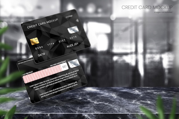 PSD 黒い大理石の卓上にリアルなデビットカードのモックアップとクレジットカードのモックアップ
