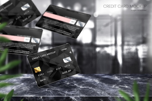 Realistic debit card mockup and credit card mockup on black marble tabletop