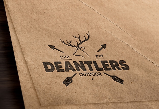 Realistic debossed logo mockup in brown paper