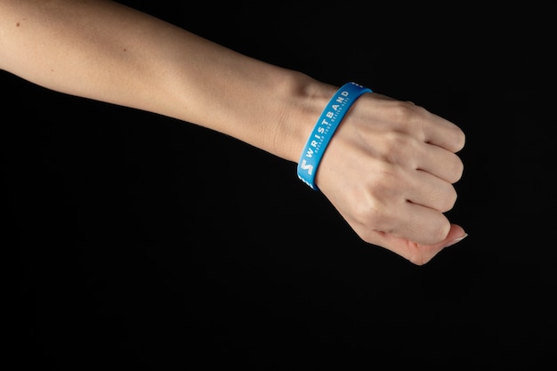 PSD realistic hand wearing blue bracelet mockup