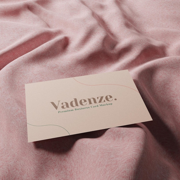 Realistic minimal business card mockup on pink fabric