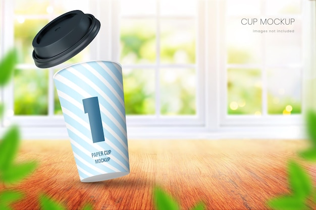 Realistic paper coffee cup mockup in bright room with big window