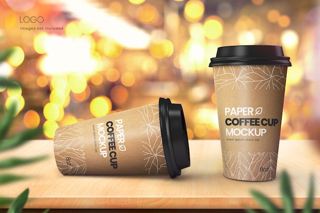 Realistic paper coffee cup mockup of two cups with bright bokeh background