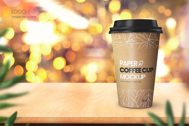 Realistic paper coffee cup mockup on wooden tabletop with bokeh lights in background