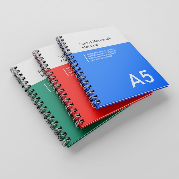 realistic three corporate hard cover metal spiral a5 binder notebook mock up design template in perspective view 