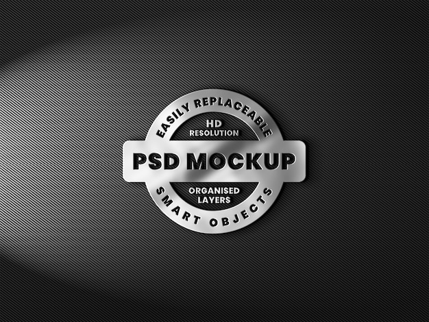 PSD realistyczna makieta logo 3d z metaliczną teksturą i odbiciem na włóknie węglowym