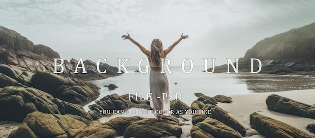 Rear view of a young woman with her arms raised happily by the sea enjoying the beautiful view