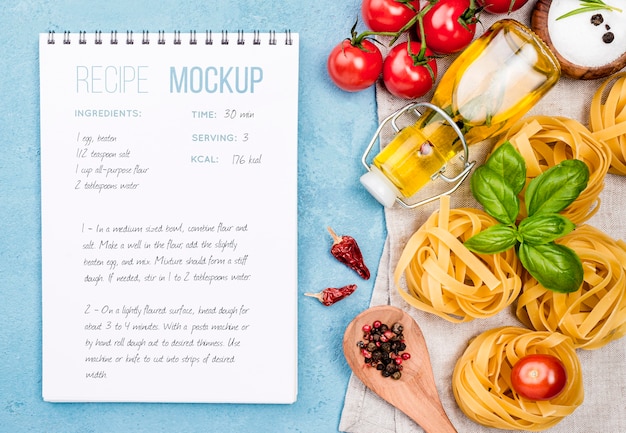 Recipe notebook and pasta arrangement