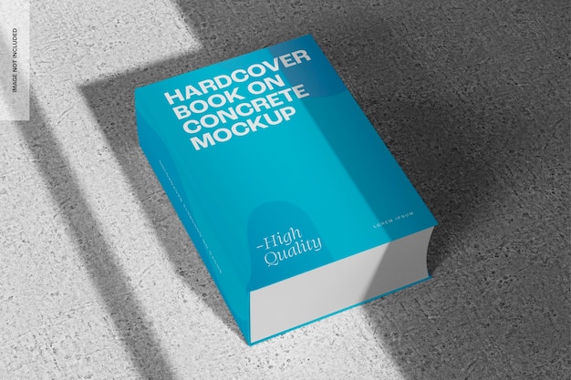 Libro rettangolare con copertina rigida su calcestruzzo mockup, prospettiva