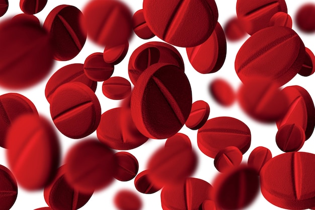 Red capsules flying in the air lots of pills on isolated transparent background