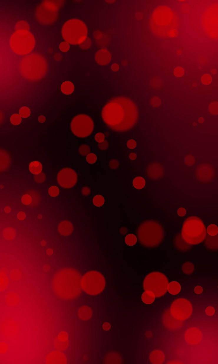PSD red defocused bokeh on a dark background