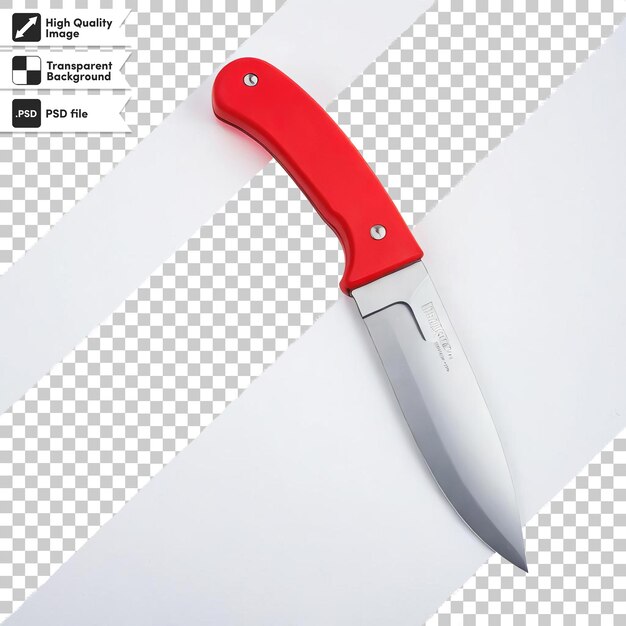 A red knife is on a white paper with a black and white background