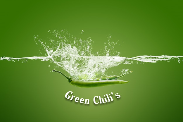 Refreshing green chili in water isolated on green