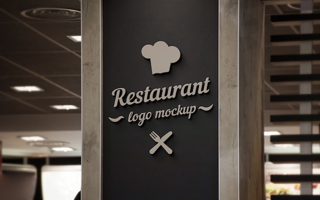 PSD restaurant 3d logo mockup on black wall.