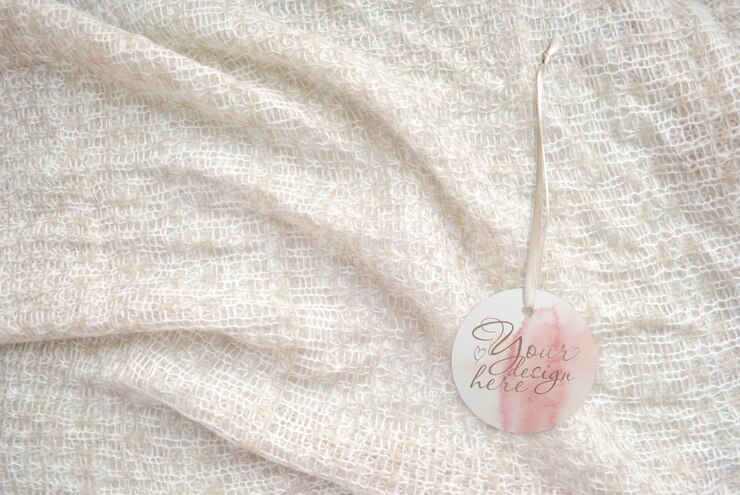 PSD round tag on the on a knitted light background