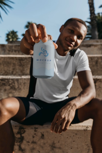 Runner holding a soda can mock-up