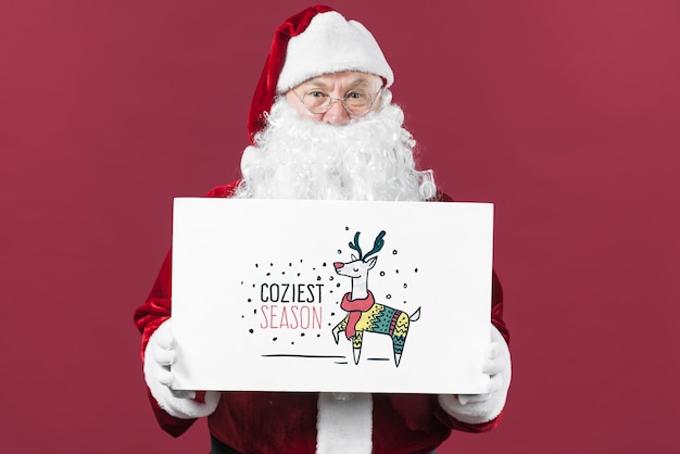 PSD santa presenting paper board mockup