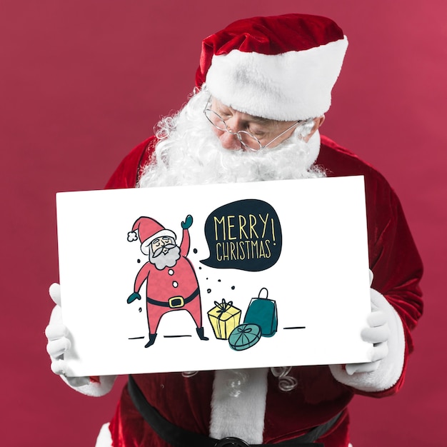 Santa presenting paper board mockup