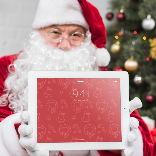 PSD santa presenting tablet mockup