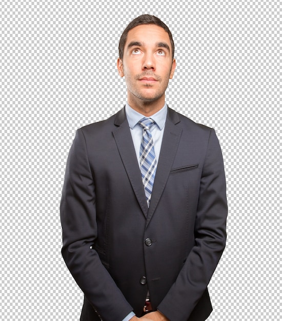 Satisfied young businessman looking up