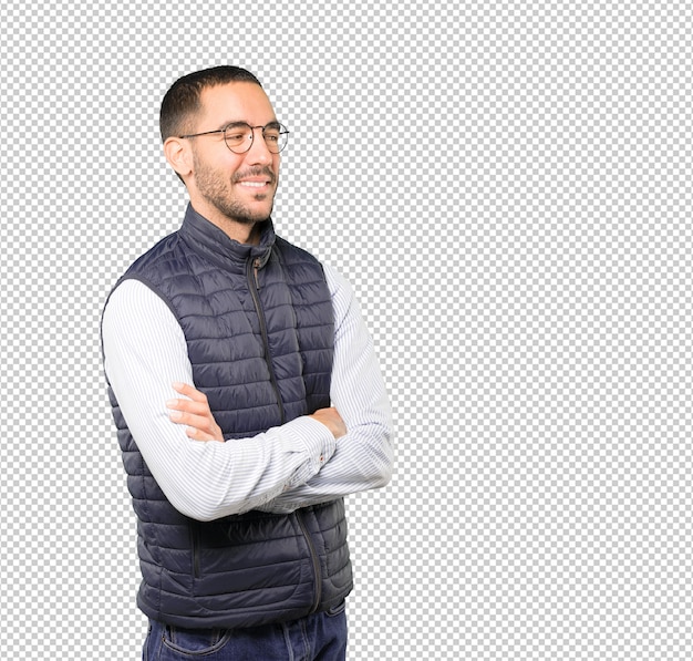 Satisfied young man with crossed arms gesture