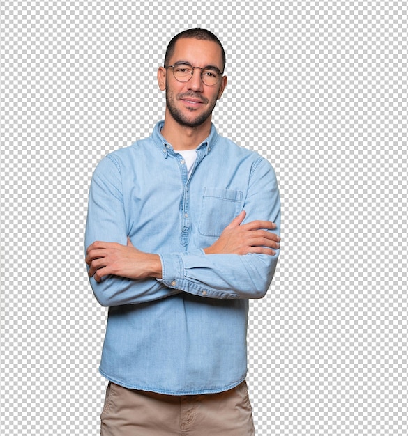 Satisfied young man with crossed arms gesture