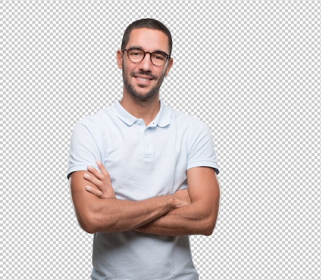 Satisfied young man with crossed arms gesture