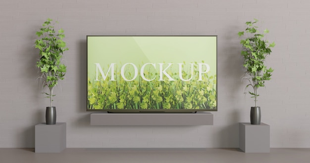PSD screen tv mockup on the table. front view screen mockup with couple decoration plants