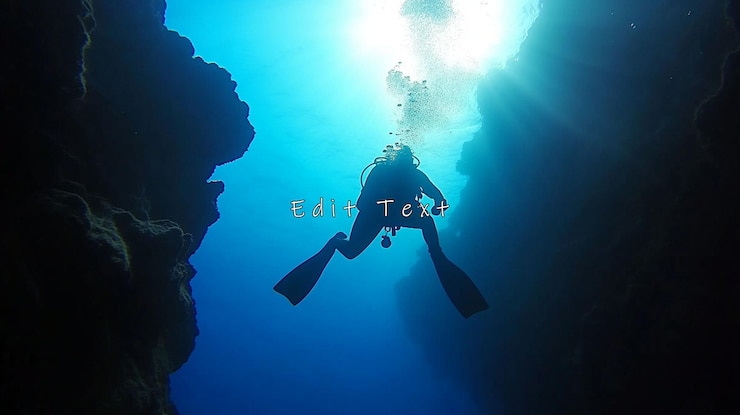 PSD scuba diver silhouetted in underwater cave