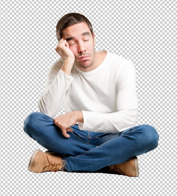 PSD seated young man with a tired gesture