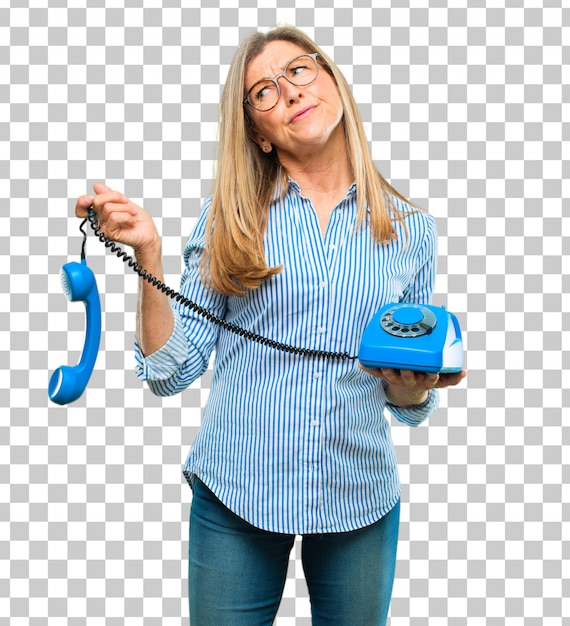 Senior beautiful woman with a vintage telephone