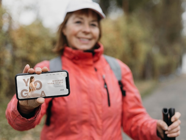 PSD senior person doing sport with phone mockup