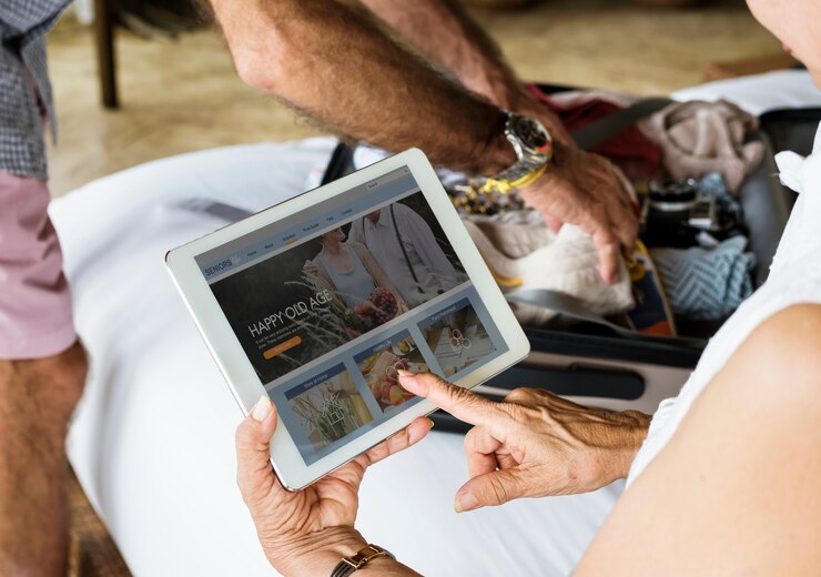 PSD senior woman using a tablet on the bed