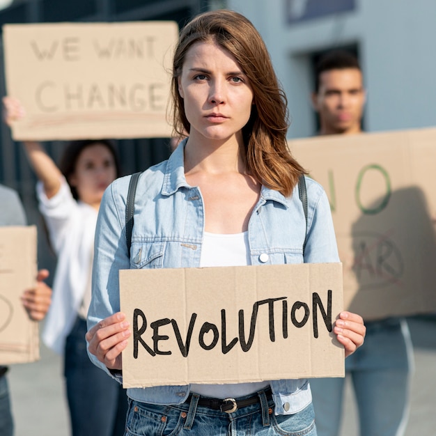 Serious woman holding board mock-up