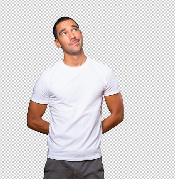 Premium PSD | Serious young man looking against background