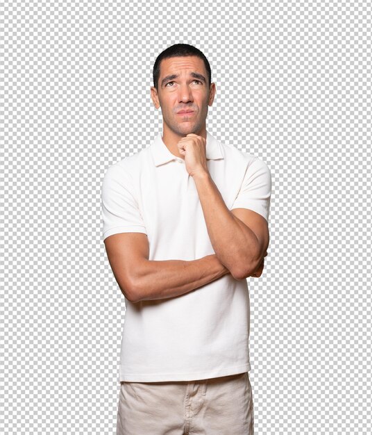 serious young man looking against background