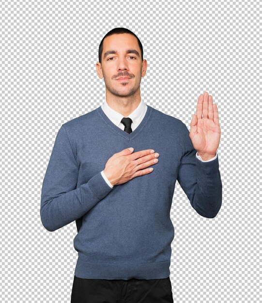 Serious young man with a gesture of oath