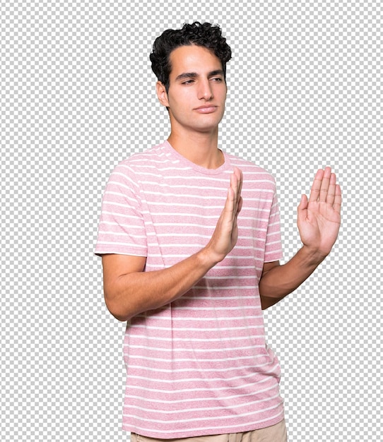 Serious young man with a gesture of oath