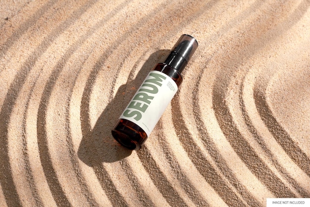 Serum bottle in sand