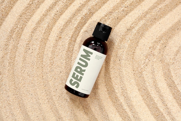 PSD serum bottle in sand