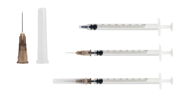 PSD set of insulin syringes needle cap on a blank background