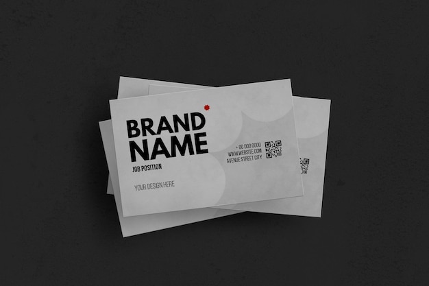 Set of white business cards over black surface mockup