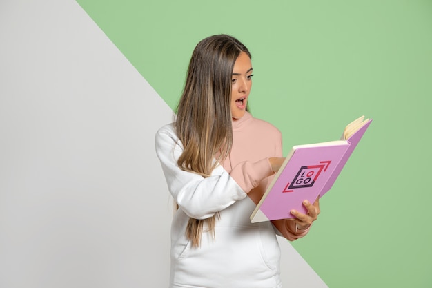 Shocked woman reading book